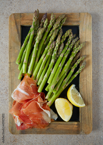 fresh green asparagus and jamon serrano photo