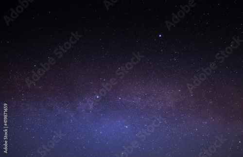 Multicolored stars in the night sky. The Milky Way.