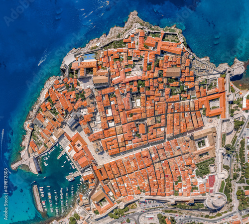 Aerial overhead drone shot of whole Dubrovnik old town by Adriatic sea in Croatia summer