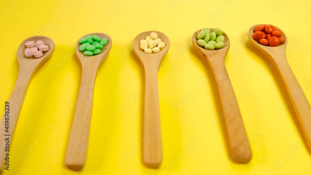 tablets in spoons. selective focus. tablets in spoons. selective focus.
