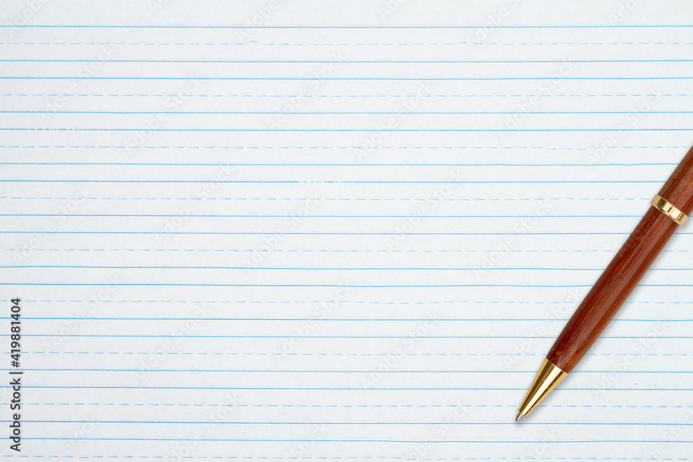 Retro lined school paper with a pen background Retro lined school paper with a pen background