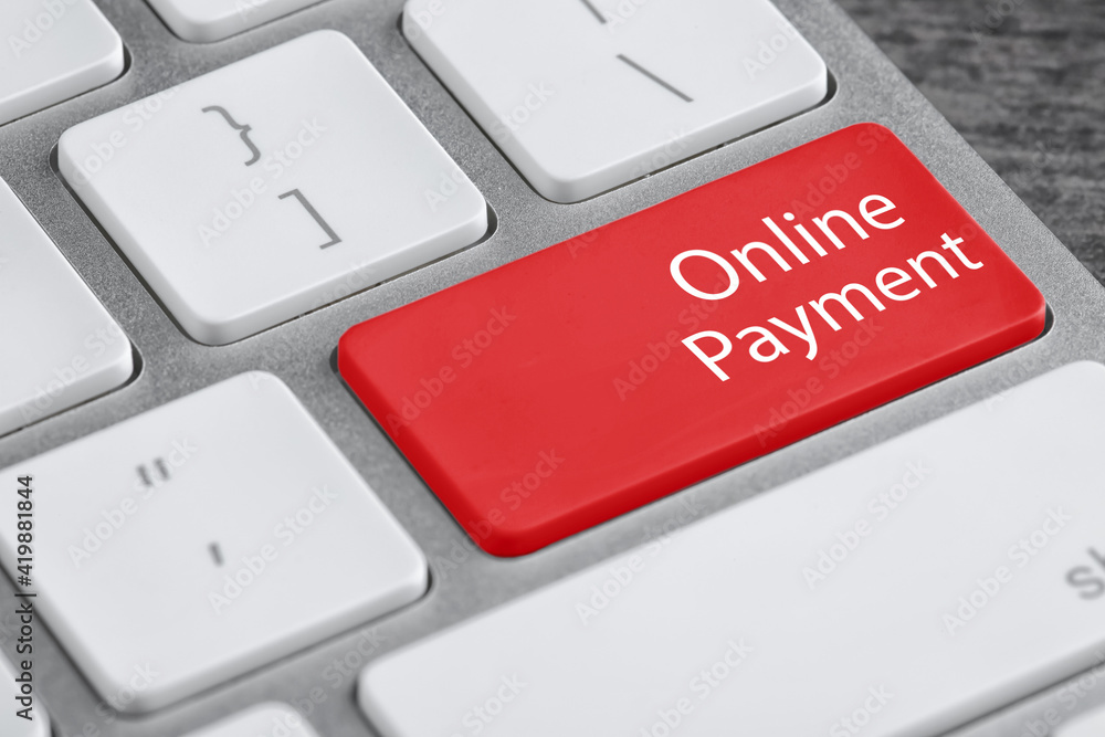 Fototapeta premium Modern laptop keyboard with text Online Payment on red button, closeup view