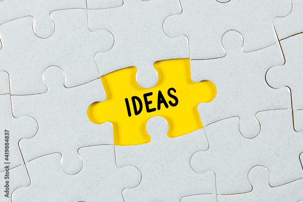 Ideas Text on Puzzle Piece - business concept Ideas Text on Puzzle Piece - business concept