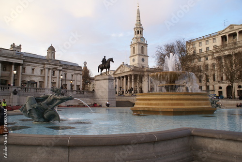 London, UK: fountain in Trafalgar square, with view of the National Gallery and St Martin-in-the-Fields in the background