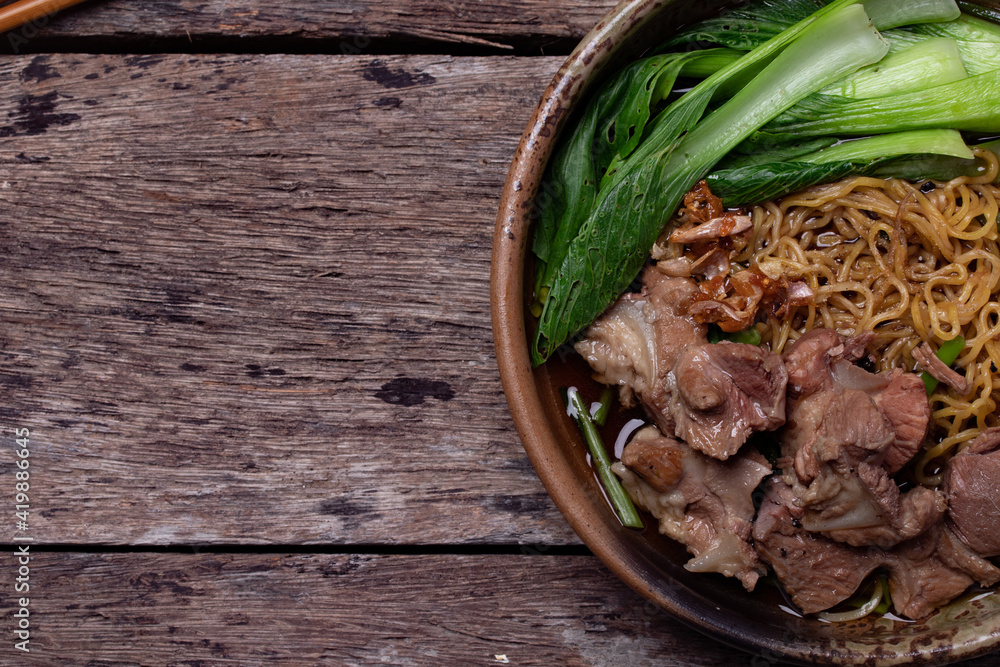 Egg Noodle Noodles with Stewed Pork and Vegetables on Wooden Floor Thai Food Egg Noodle Noodles with Stewed Pork and Vegetables on Wooden Floor Thai Food