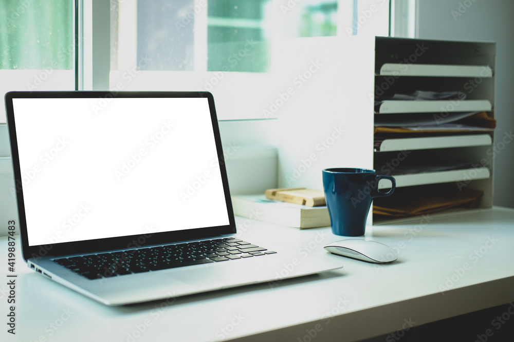 Modern workspace with computer with blank screen and equipment on white table.Blank screen for your information. Modern workspace with computer with blank screen and equipment on white table.Blank screen for your information.
