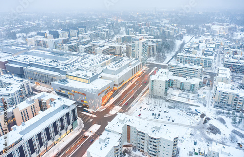 Obraz na płótnie Aerial view of the modern shopping mall in Matinkyla neighborhood of Espoo, Finland. The winter cityscape. w salonie
