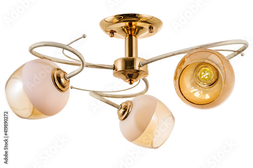 White three-lamp chandelier with a golden base and transparent matt shades. Isolated on white background
