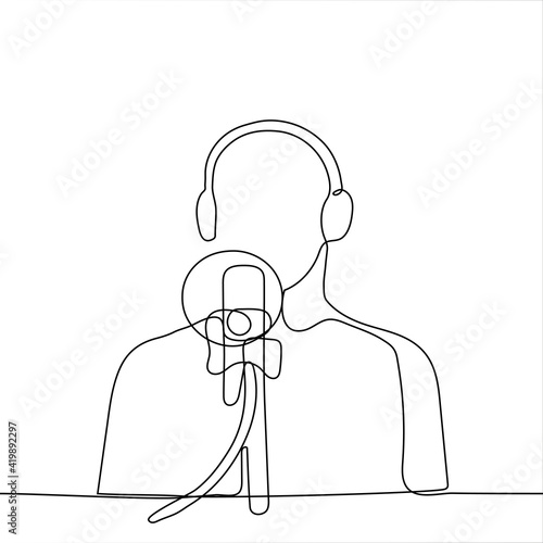 man sits in front of a professional microphone wearing over ear headphones - one line drawing. blogger during stream, podcast recording, radio interview