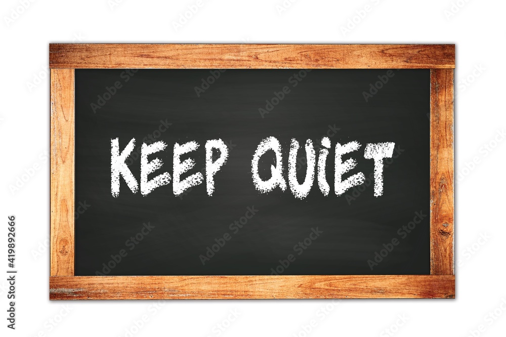 KEEP QUIET text written on wooden frame school blackboard. KEEP QUIET text written on wooden frame school blackboard.