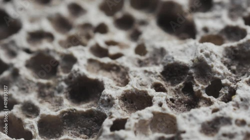 Macro slide shot, the surface of the pumice stone, similar to craters on the moon.