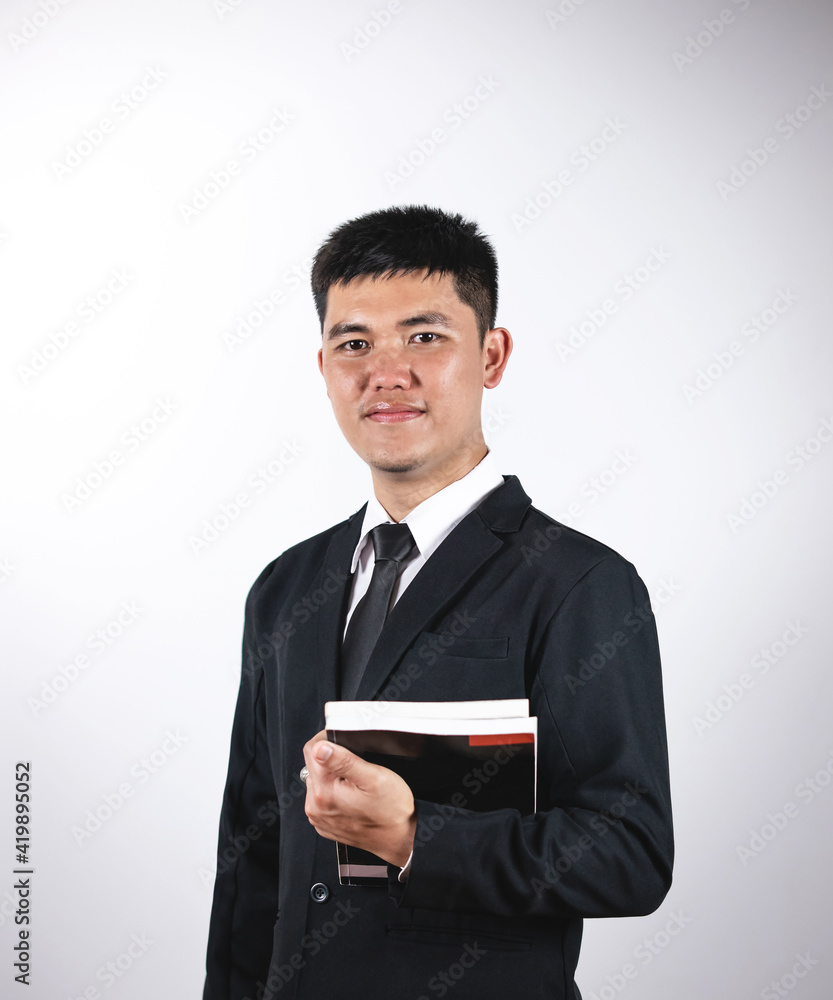 Teacher portrait.
A asian teacher with a book. Isolated on white background Teacher portrait.
A asian teacher with a book. Isolated on white background