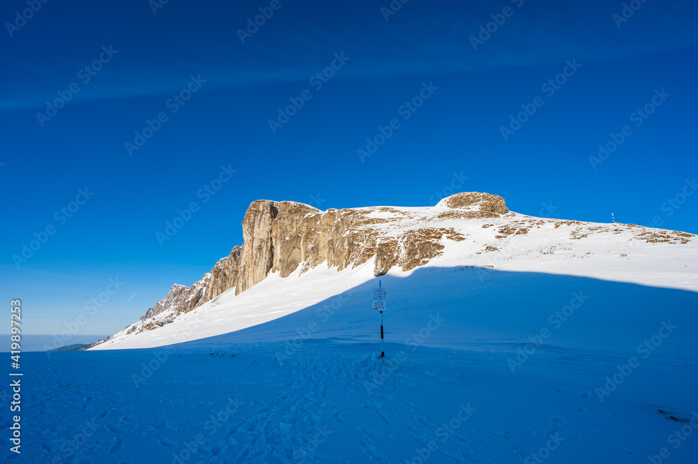Scarp face in snowy mountain landscape