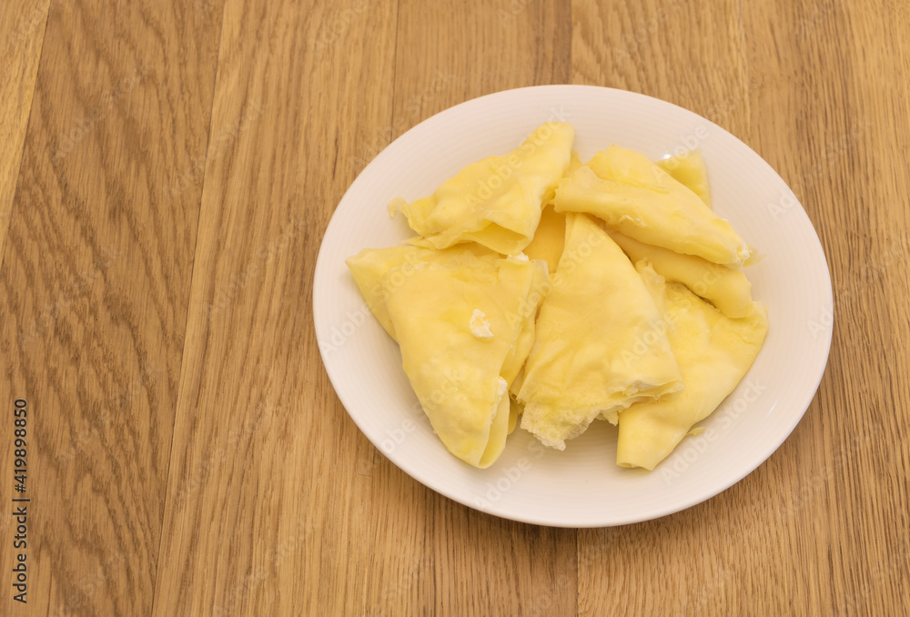 Homemade sweet and tasty pancakes with cheese on wooden background Homemade sweet and tasty pancakes with cheese on wooden background