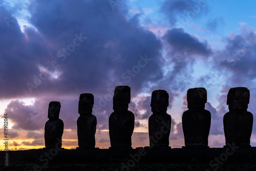 Moai Statues silhouette at sunrise at Ahu Tongariki, Easter Island (Rapa Nui), Chile.