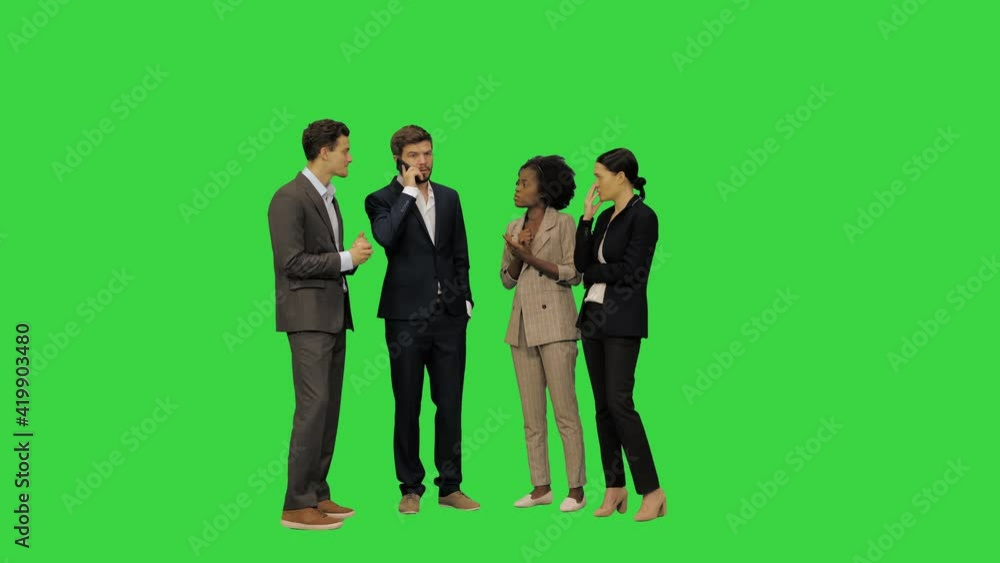 Business team having an important call, one of the colleagues is speaking the rest are listening attentively, they seem to be anxious on a Green Screen, Chroma Key. Business team having an important call, one of the colleagues is speaking the rest are listening attentively, they seem to be anxious on a Green Screen, Chroma Key.