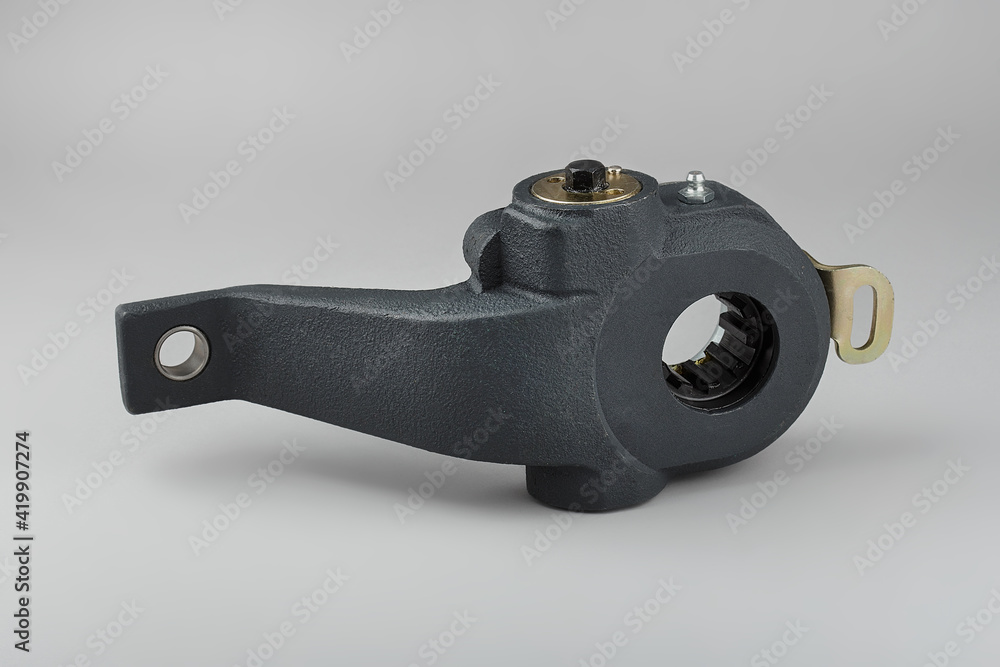 Slack adjuster.Brake slack adjuster on the gray background. Truck parts. Car parts. Parts on the gray background. Ratchet. Slack adjuster.Brake slack adjuster on the gray background. Truck parts. Car parts. Parts on the gray background. Ratchet.