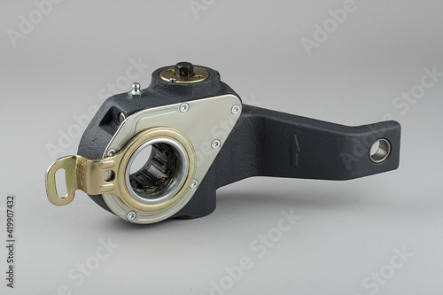 Slack adjuster.Brake slack adjuster on the gray background. Truck parts. Car parts. Parts on the gray background. Ratchet.