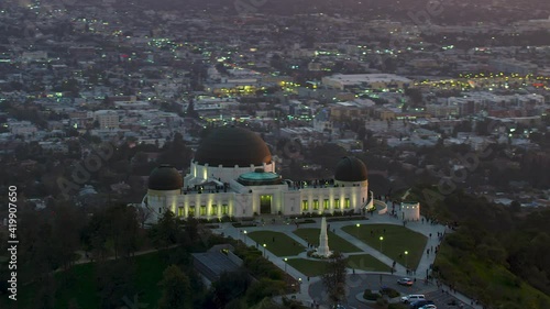 Amazing view of the Griffith Observatory in Mount Hollywood. Crowded entrance lawn and observation deck. Los Angeles, California. Beautiful sky during sunset. Shot on Red Weapon 8K.
