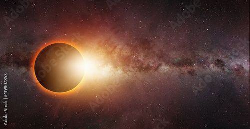 Solar Eclipse Milky way galaxy in the background  Elements of this image furnished by NASA  