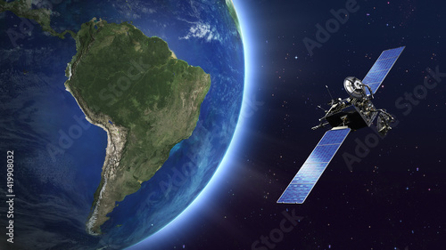 Highly detailed telecommunication satellite orbiting the Earth. South America map. photo