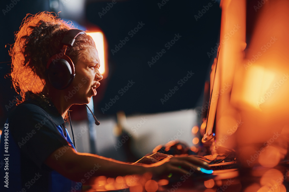 Failure. Side view of angry mixed race girl, female cybersport gamer ...