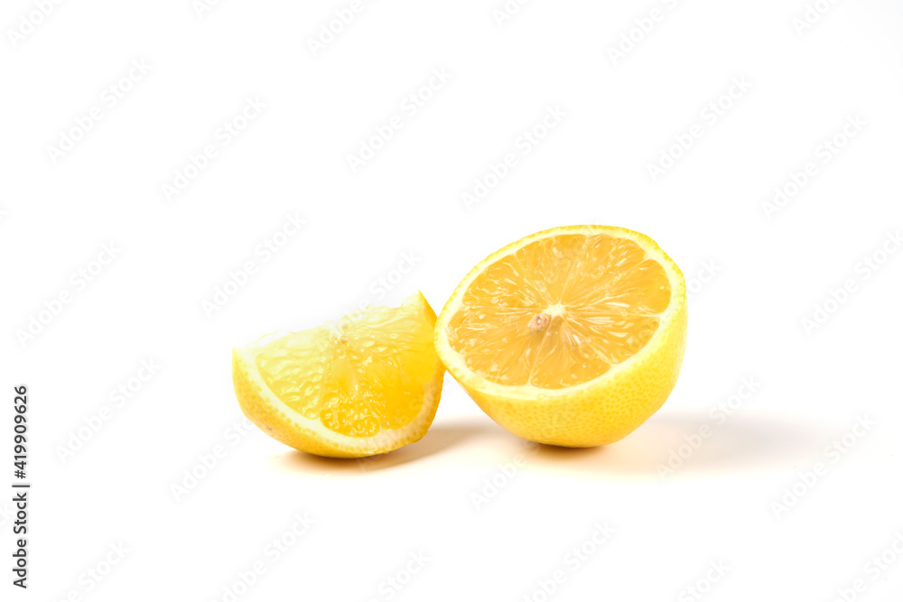 A slice and half lemons isolated on white background A slice and half lemons isolated on white background