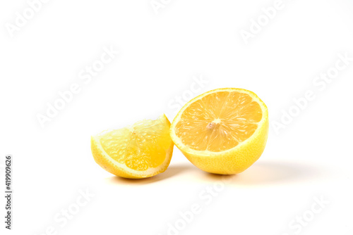 A slice and half lemons isolated on white background