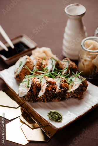 Set of sushi with herbs on a beautifully decorated table