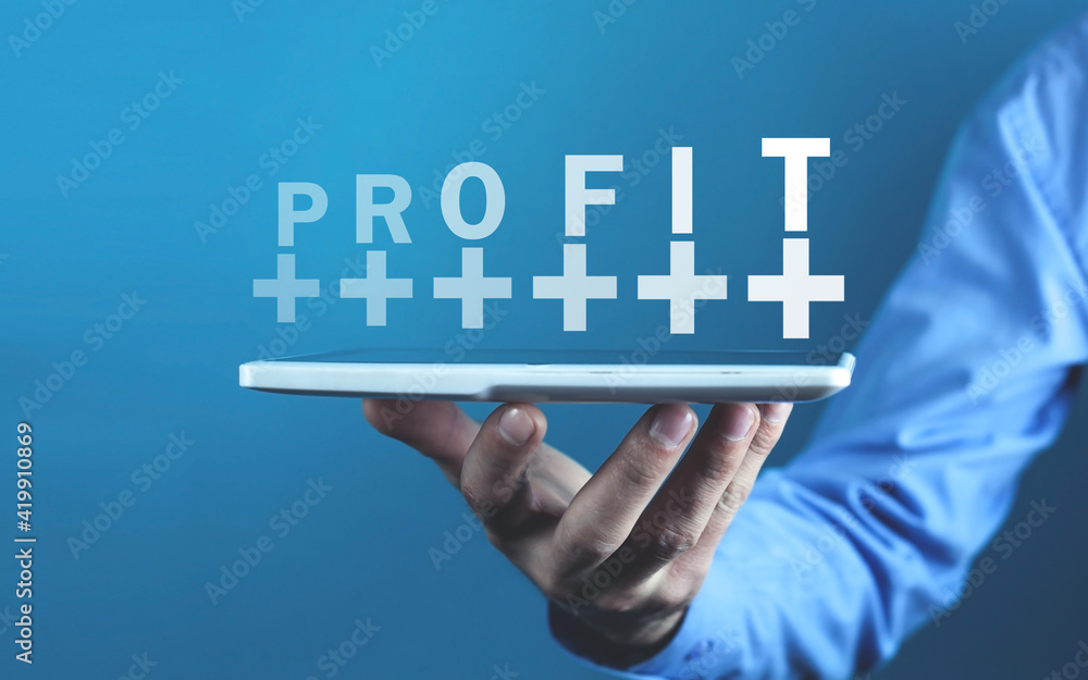 Businessman holding Profit word with a plus symbols. Businessman holding Profit word with a plus symbols.
