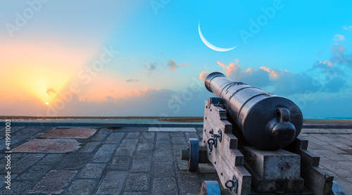 Fotografering Ramadan Concept - Ramadan kareem cannon with crescent - Night sky with moon in t