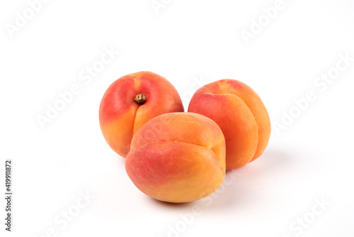 Three peaches isolated on white background macro view