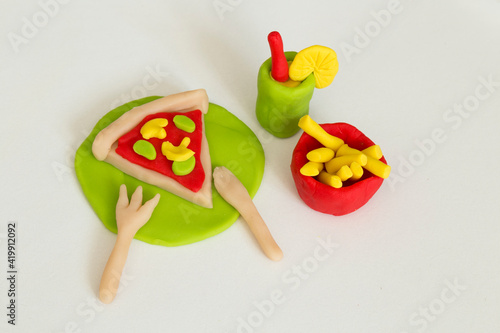 Making pizza and fried potatoes game step by step with play dough for children's activity in the school art lesson and plasticine concept.