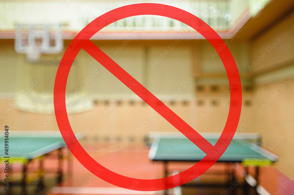 gym ban due to sanitary measures. Naturally blurred interior of modern gym with tables for ping-pong