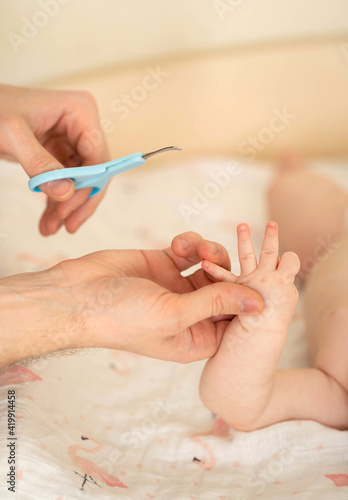 The baby s fingernails are trimmed. Hygiene for babies.