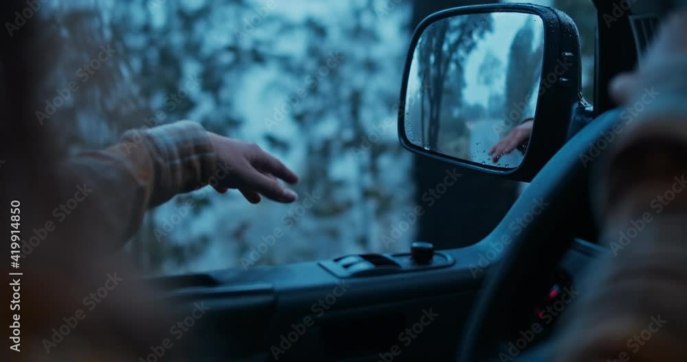 Cinematic inspirational video of young woman traveling by car or camper van, opens window to breathe fresh air of forest, moves hand in wind. Sings melody of song, summertime or winter vacation vibes Cinematic inspirational video of young woman traveling by car or camper van, opens window to breathe fresh air of forest, moves hand in wind. Sings melody of song, summertime or winter vacation vibes