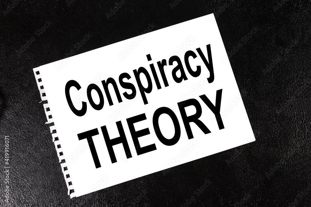 Conspiracy Theory. text on white paper on black background Conspiracy Theory. text on white paper on black background