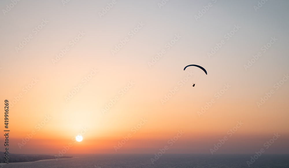 Parachuting - Paragliding in sunset Parachuting - Paragliding in sunset