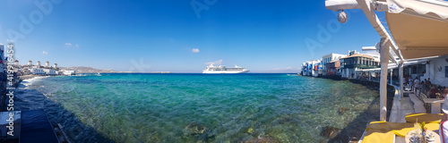 Panoramic view of a cruise ship from the promenade of mykonos island © xmen