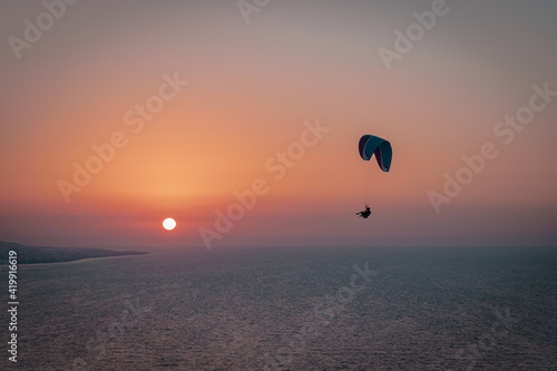 Parachuting - Paragliding in sunset