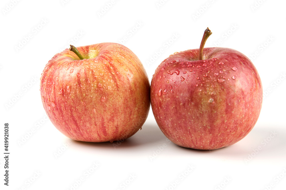 Two single whole red apple on white