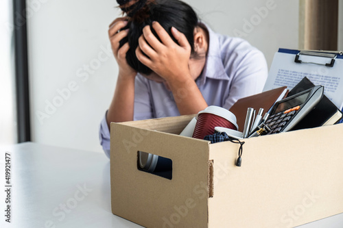 Stress of business woman employee intend to sending resignation letter to boss employer consider in order to contract for quit or layoff of job leaving from work, resignation concept photo