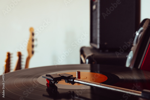 Photography Vintage portable record player playing a vynil record with copyspace