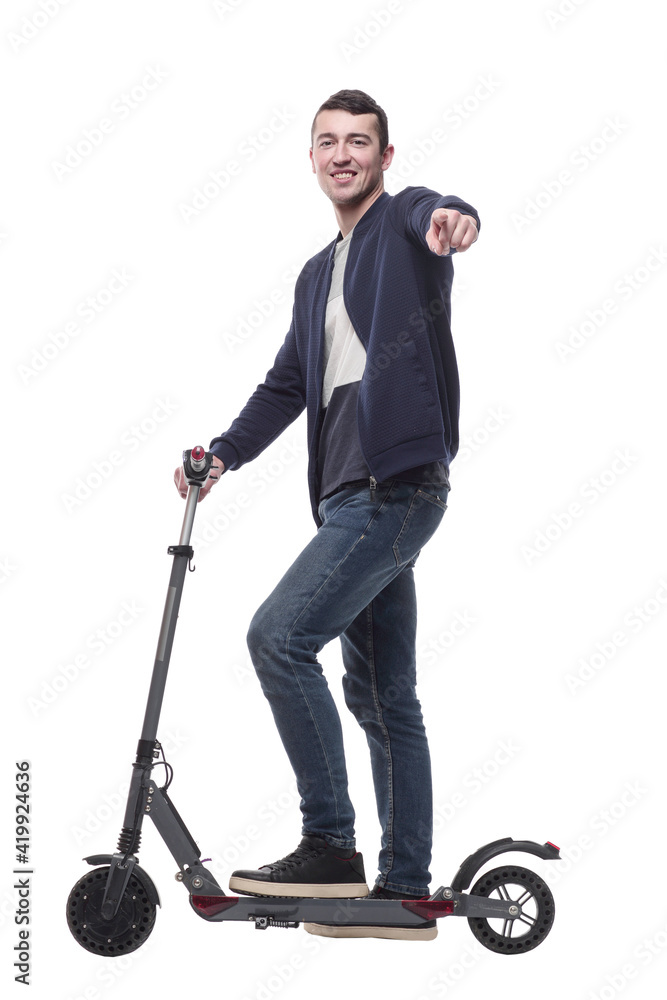 smiling young man with an electric scooter . smiling young man with an electric scooter .