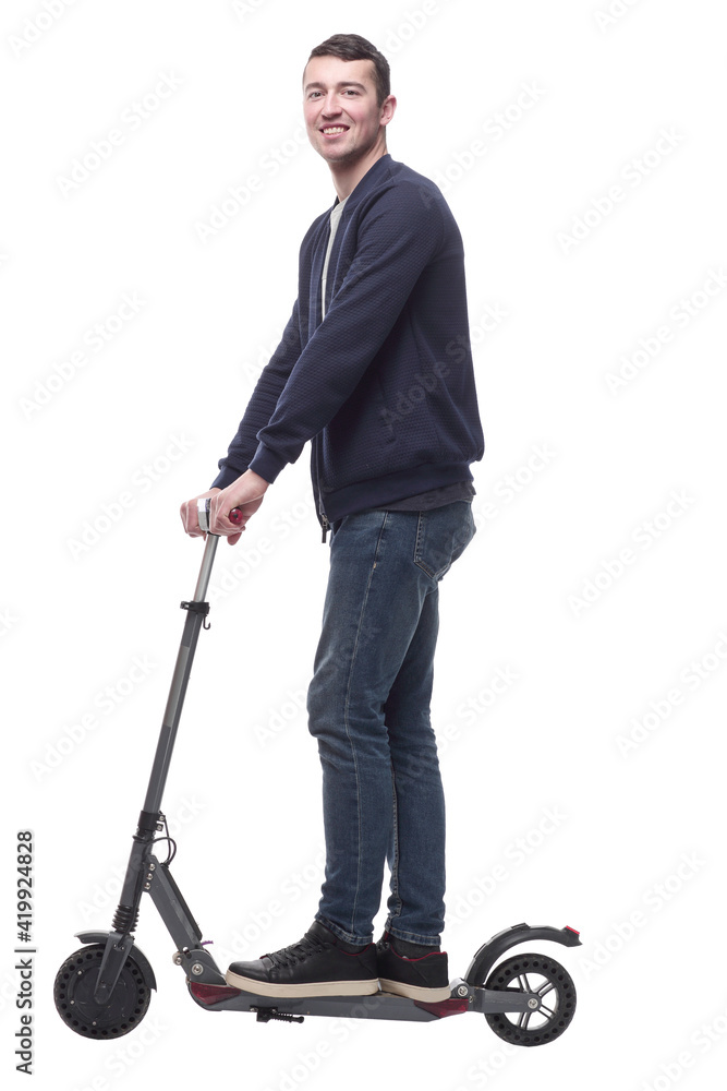 smiling young man with an electric scooter . smiling young man with an electric scooter .