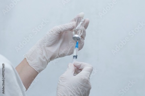 the nurse with a vaccine on a white background