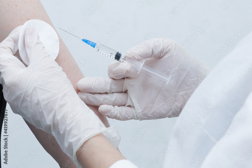 a nurse makes a vaccine for a patient a nurse makes a vaccine for a patient
