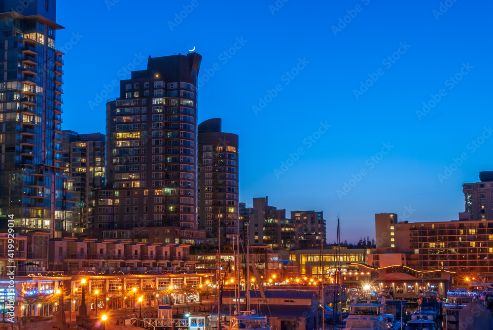 Cityscape Night. Evening illumination in seawalk in Vancouver, Canada. Cityscape Night. Evening illumination in seawalk in Vancouver, Canada.