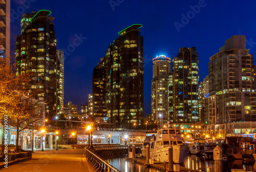 Cityscape Night. Evening illumination in seawalk in Vancouver, Canada.