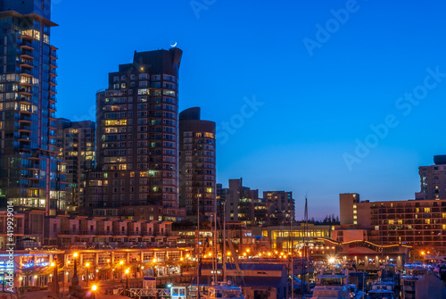 Cityscape Night. Evening illumination in seawalk in Vancouver, Canada. photo